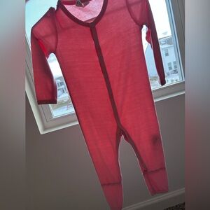 Peachy pink colored button up footless Kyte Baby pjs!